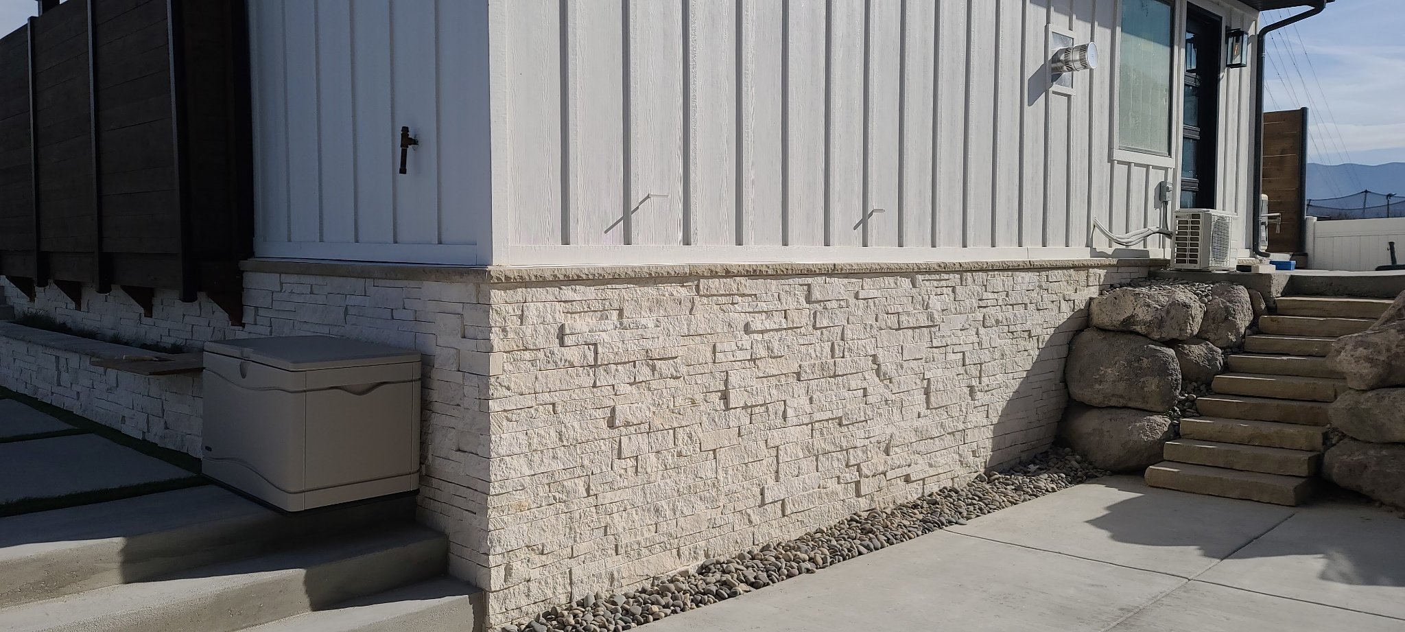 Exterior wall clad in stone veneer